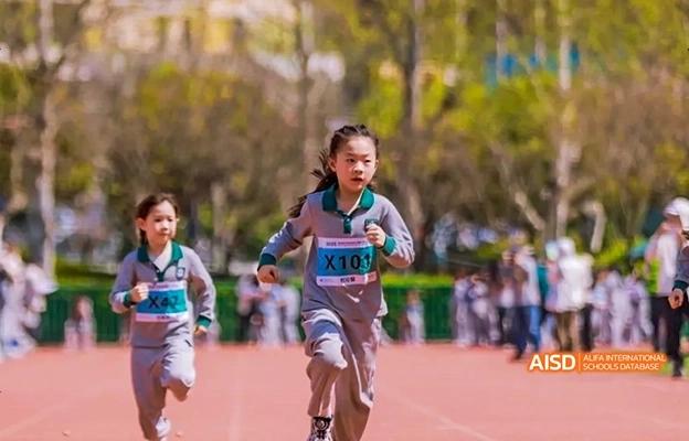 A girl running in a race at Chongqing Depu Foreign Language School