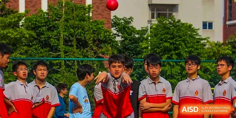 Students playing basketball outdoors at DongGuan Laguna Verona Foreign Language School.