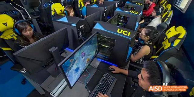 Students engage in an esports or gaming competition in a lab with modern computer setups at Hefei No.8 High School.