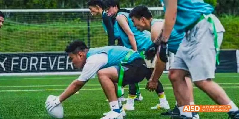 Kunming No.1 High School International Education students playing a game of tag football during a sports event.