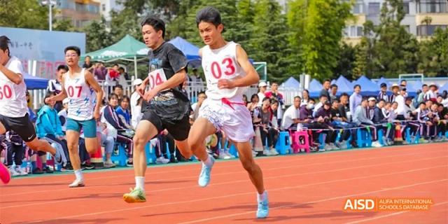 A student from Kunming No.1 High School International Education with the number "03" on their shirt runs in a race.