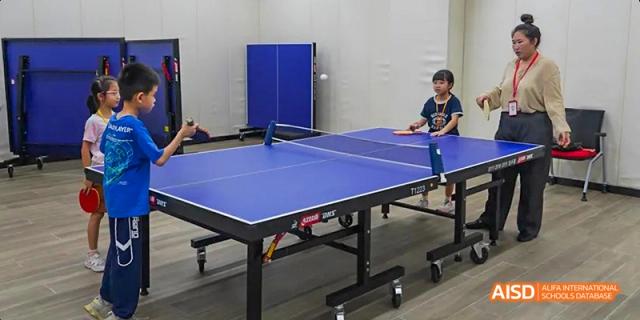 A blue ping-pong table in the gymnasium or activity room at Lady Eleanor Holles International School Foshan (LEH Foshan).