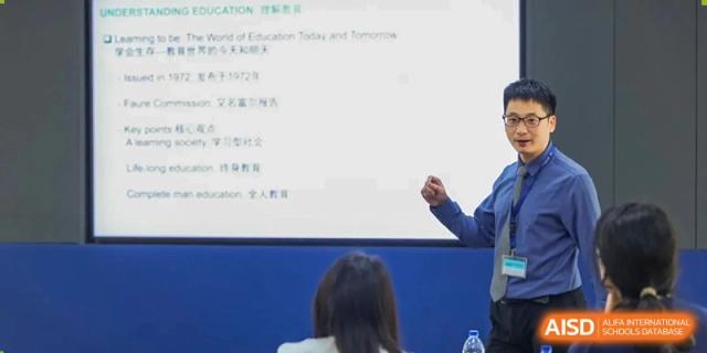 A teacher from Nord Anglia School Guangzhou Panyu giving a presentation to students in a classroom.