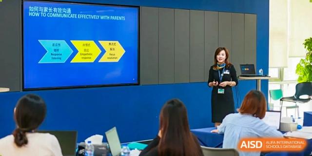 A student and teacher from Nord Anglia School Guangzhou Panyu working together on a project.