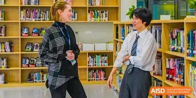 Students and a teacher from Nord Anglia School Guangzhou Panyu in the school library.