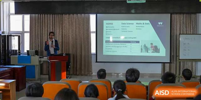A teacher from RCF Experimental School giving a lecture to students in a classroom.