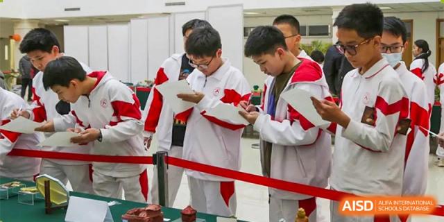 Students from RCF Experimental School participating in a science or academic fair, looking at projects.