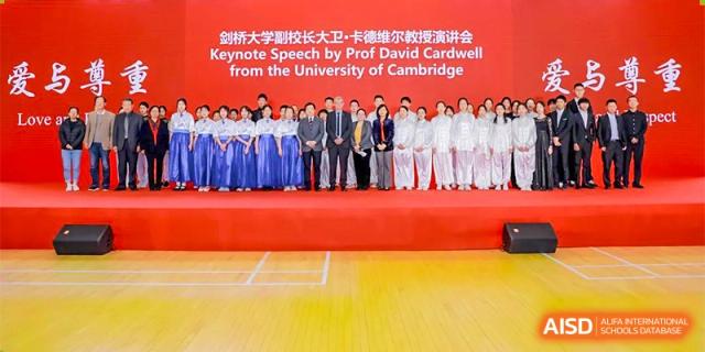 A group of RCF Experimental School students and staff standing on a stage during an award ceremony.