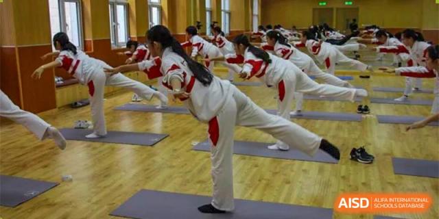 Students from RCF Experimental School participating in a yoga or physical fitness class.