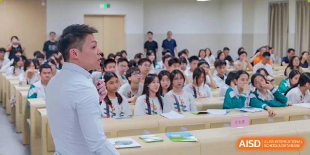 A close-up view of a large group of students in uniform seated and engaged in a lecture or event at Guangdong Experimental High School IFPAD & A-Level.