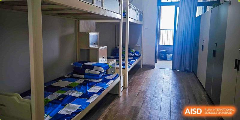 Interior view of a student dormitory room with bunk beds at Guangdong Experimental High School IFPAD & A-Level.