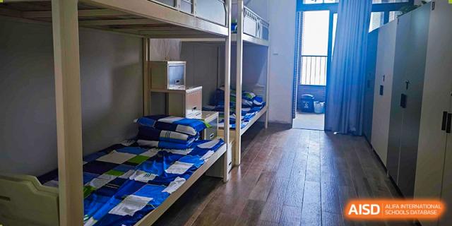 Interior view of a student dormitory room with bunk beds at Guangdong Experimental High School IFPAD & A-Level.