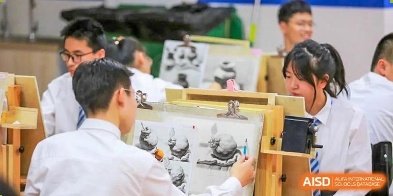 Students focus intently on their charcoal sketches during a professional fine arts or drawing class at Hefei High-tech Sino-Canadian School.