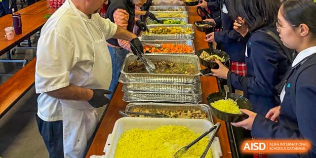 A buffet line with a variety of food options for students from The High School Affiliated To Beijing Normal University.