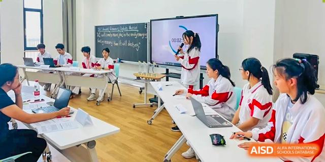 Students from The High School Affiliated to Renmin University of China, Tongzhou Campus, play instruments in a classroom.