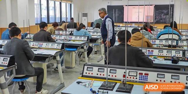 Tianfu school The Integrated and Innovative Curriculum students and a teacher in a science lab with equipment.
