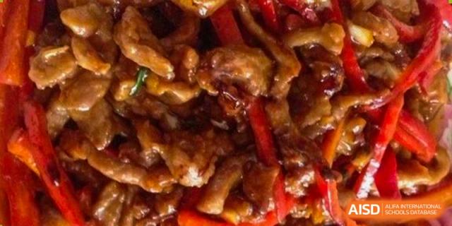 A stir-fried meat and vegetable dish, a common meal at Tianfu school The Integrated and Innovative Curriculum.
