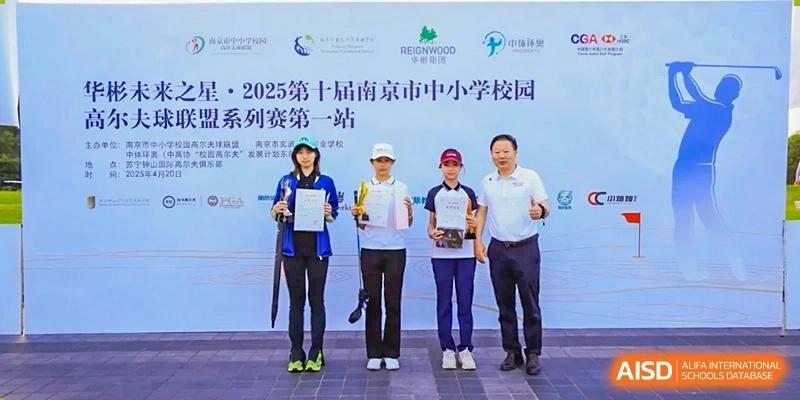 A group of people, including staff from Times College, standing together with awards during an event.
