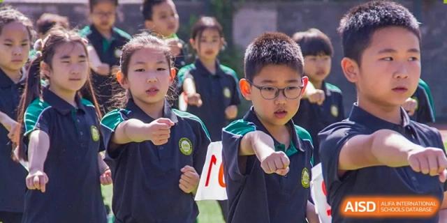 A student from Times College in a martial arts stance during a demonstration.