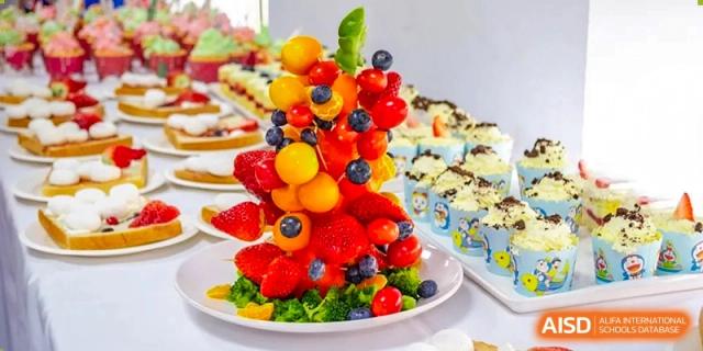 A creative and colorful fruit and vegetable display from a health and nutrition event at Times College.