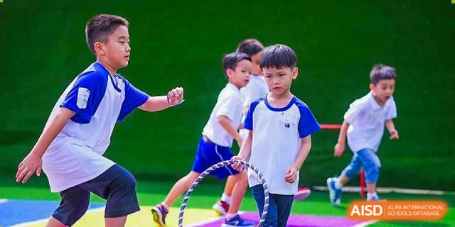 A close-up of a young UWC Changshu China student with a serious expression holding a jump rope.