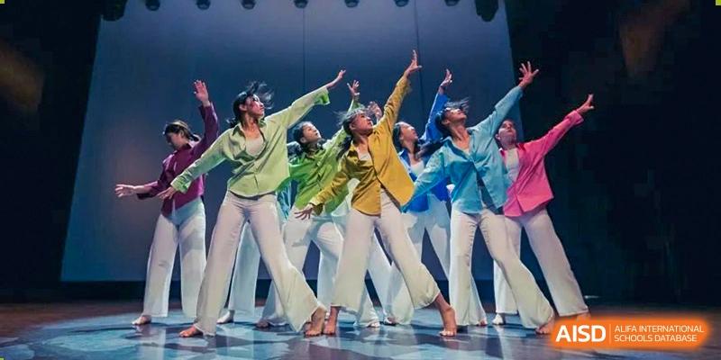 Western Academy of Beijing students performing a modern dance on a stage.