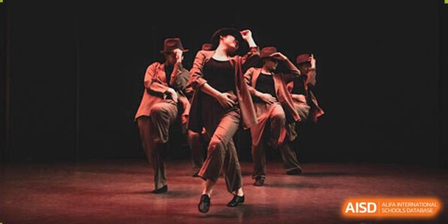 Western Academy of Beijing students performing a modern dance on a stage.