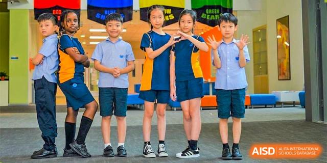 A group of students from Yew Wah International Education School Of Beijing Yizhuang Campus pose together in their school uniforms.