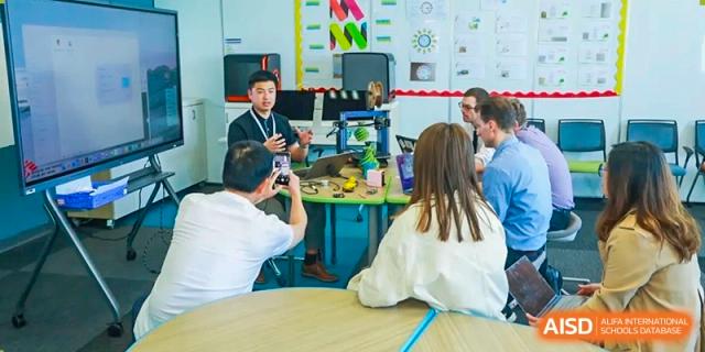 Students at Yew Wah International Education School Of Beijing Yizhuang Campus work together on a project.