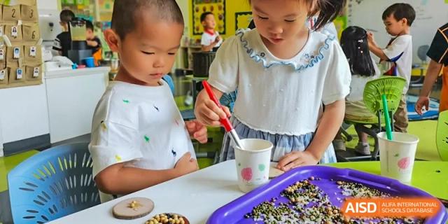 Children at Yew Wah International Education School Of Beijing Yizhuang Campus participate in an art class.
