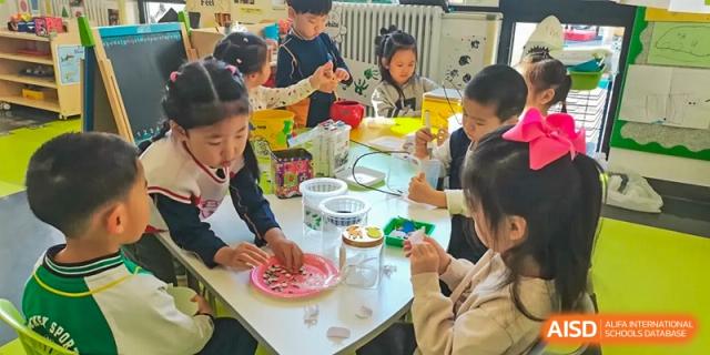 Children at Yew Wah International Education School Of Beijing Yizhuang Campus participate in a group activity.