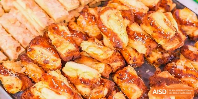 A close-up shot of grilled chicken wings served at Yew Wah International Education School Of Beijing Yizhuang Campus.