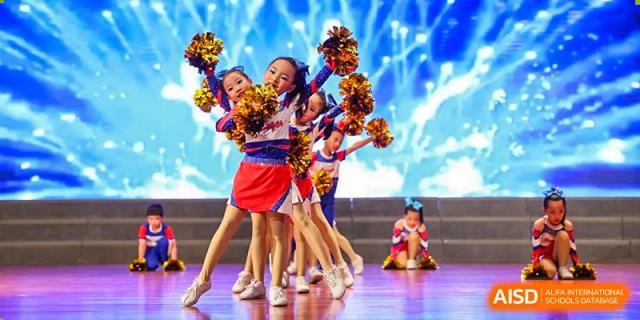 Nanjing Dongshan Foreign Language School International Department cheerleading team performing a dance routine.