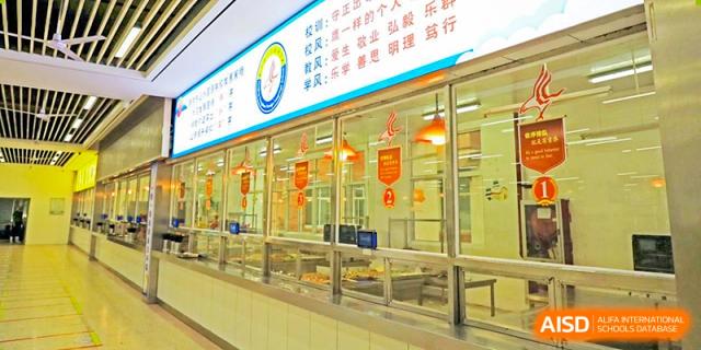 A row of glass refrigerators containing drinks at Nanjing Dongshan Foreign Language School International Department cafeteria.