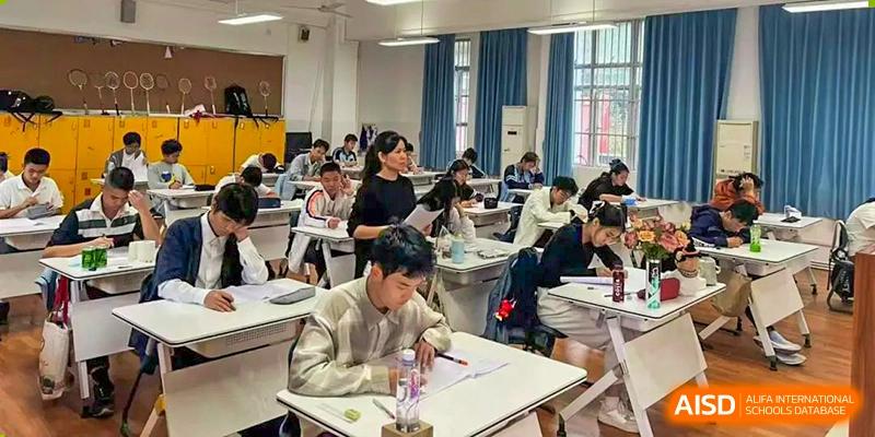 Students from Nanning No.2 High School International Division are studying and taking a test in a classroom.