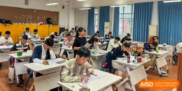 Students from Nanning No.2 High School International Division are studying and taking a test in a classroom.