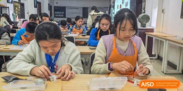 Students from Nanning No.2 High School International Division are working on a hands-on project in a classroom.