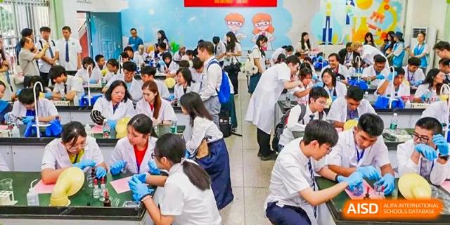 Students from Nanning No.2 High School International Division are participating in a hands-on activity, possibly during a school festival or fair.