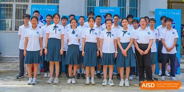 A close-up of students from Nanning No.2 High School International Division standing in their school uniforms.
