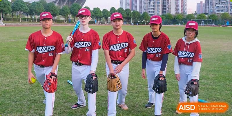 Students from Nanning No.2 High School International Division are wearing baseball uniforms and standing on a field.