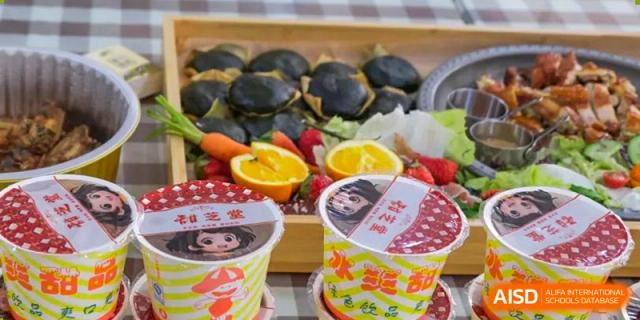 A variety of dishes, including black buns and cups of food, from the cafeteria at Nanning No.2 High School International Division.