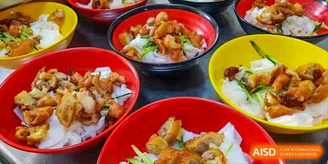 A close-up of a bowl of stir-fried food from the cafeteria at Nanning No.2 High School International Division.