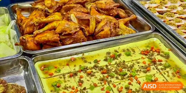 A tray of baked chicken wings and other food from the cafeteria at Nanning No.2 High School International Division.