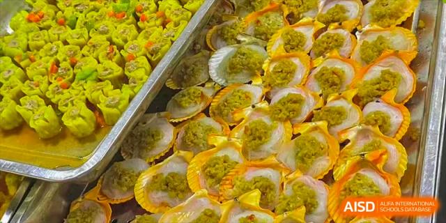 A tray of baked seafood in shells from the cafeteria at Nanning No.2 High School International Division.