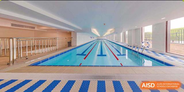 An indoor swimming pool with lanes ready for use at BASIS International & Bilingual Schools Chengdu.