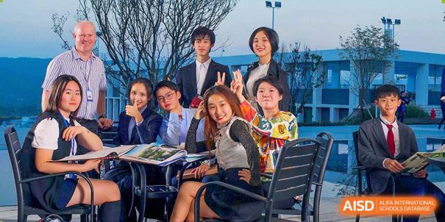 Students and teachers from BASIS International & Bilingual Schools Chengdu smiling and posing for a group photo.