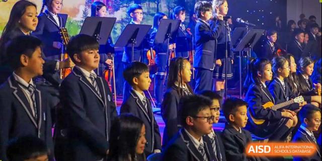Students from BASIS International & Bilingual Schools Chengdu in formal wear, possibly for a graduation or awards ceremony.