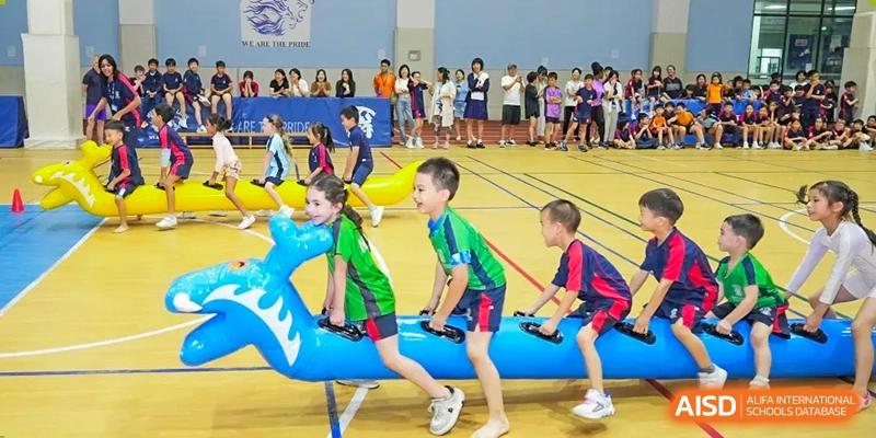 Young Merchiston International School Shenzhen students participating enthusiastically in a fun, active field day or sports carnival event.