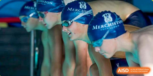 Merchiston International School Shenzhen student swimmers lined up in caps and goggles ready for a competitive swim race.