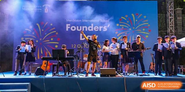 Merchiston International School Shenzhen student band or musical group performing live on a brightly lit stage.